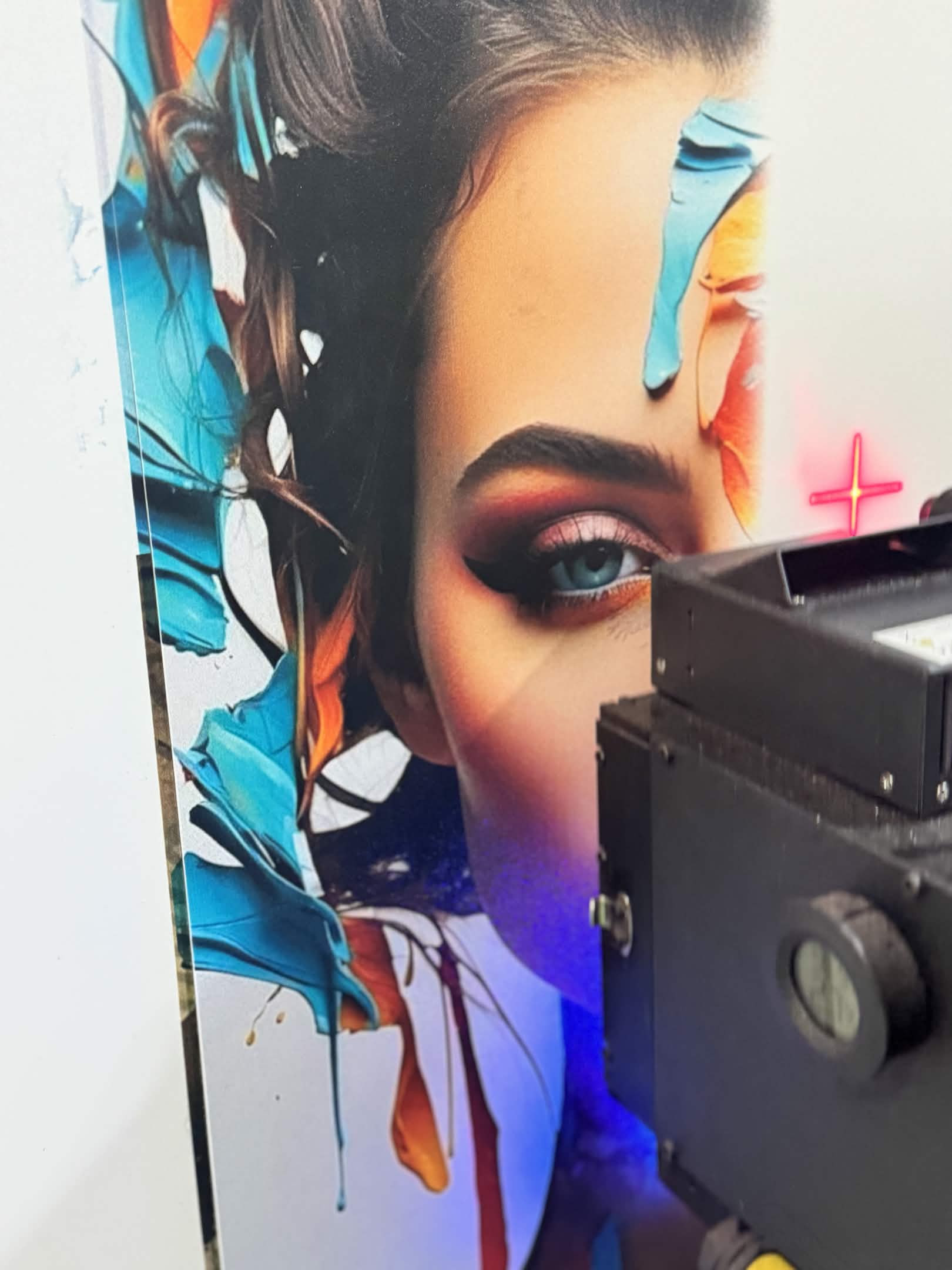 Artistic female portrait with paint splashes being printed